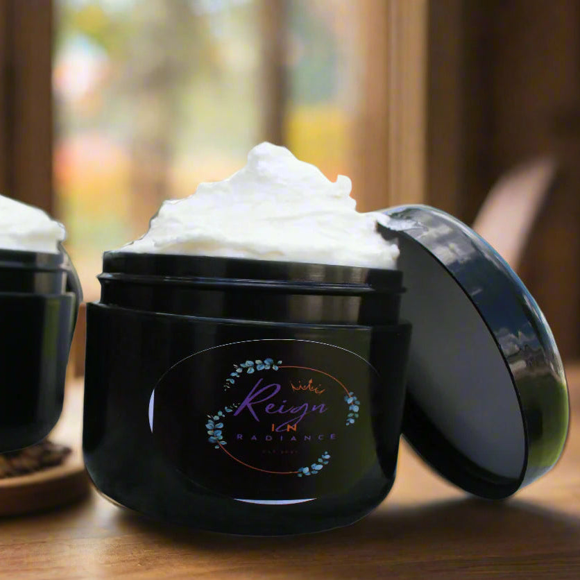 Two black jars with whipped cream-like substance on a marble surface.
