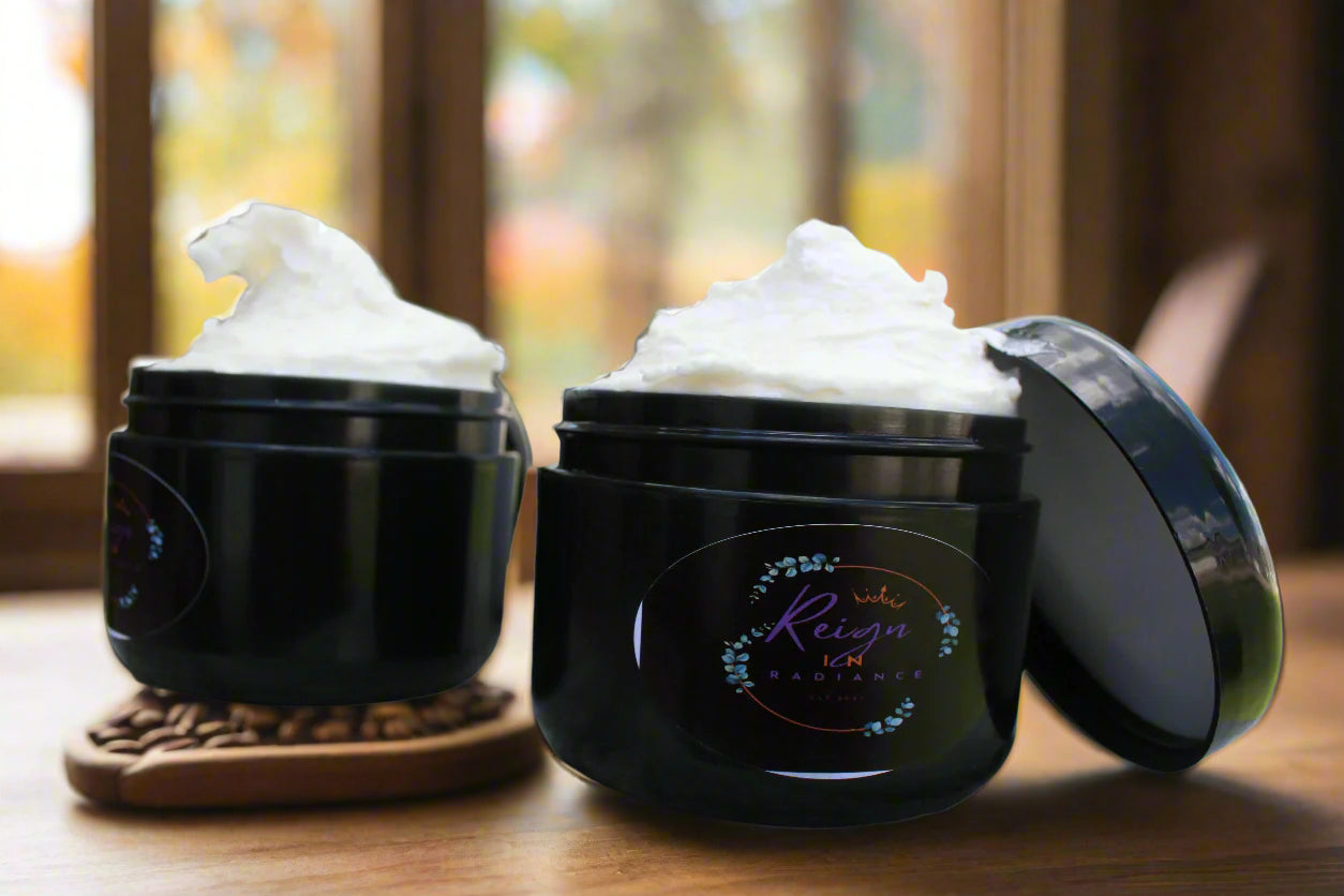 Two black jars with whipped cream-like substance on a marble surface.